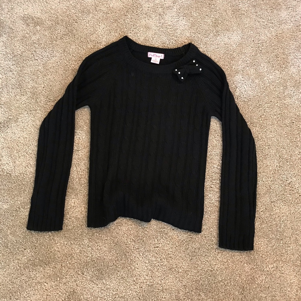 Black sweater with a pearled bow.